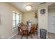 Cozy dining area with decorative lighting next to the bright window at 7608 Harbour, Indianapolis, IN 46240