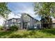Charming multi-story home with a deck overlooking a large lake, perfect for outdoor entertaining and relaxation at 7608 Harbour, Indianapolis, IN 46240