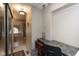 Hallway features built-in desk, tile floors, and leads to the primary bathroom with soaking tub and shower at 7608 Harbour, Indianapolis, IN 46240