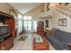 Spacious living room with high ceilings, fireplace, and staircase to the second floor at 7608 Harbour, Indianapolis, IN 46240