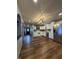 Spacious kitchen with stainless steel appliances, white cabinets, and wood flooring at 7627 Venetian Way, Indianapolis, IN 46217