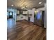 Modern kitchen featuring stainless steel appliances, white cabinetry, and stylish backsplash at 7627 Venetian Way, Indianapolis, IN 46217