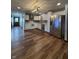 Modern kitchen featuring stainless steel appliances, white cabinetry, and stylish backsplash at 7627 Venetian Way, Indianapolis, IN 46217