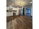 Kitchen with stainless steel appliances, white cabinets, and modern light fixture at 7627 Venetian Way, Indianapolis, IN 46217