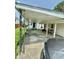 Exterior shot of the carport featuring sturdy support beams and ample covered parking space at 803 W 12Th St, Anderson, IN 46016