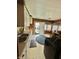 Kitchen with white cabinets, stainless steel appliances, and a decorative rug at 803 W 12Th St, Anderson, IN 46016