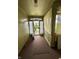 Charming porch with beadboard walls, ample natural light and an inviting entrance perfect for relaxing at 803 W 12Th St, Anderson, IN 46016