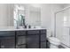 Bright bathroom with a double vanity, shower, toilet, and sleek fixtures at 830 Black Rock Cir, Lebanon, IN 46052