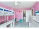 Bright pink bedroom featuring a bunk bed, carpeted floors, and a walk-in closet at 830 Black Rock Cir, Lebanon, IN 46052