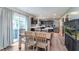Modern dining area featuring wood flooring and sliding glass doors at 830 Black Rock Cir, Lebanon, IN 46052