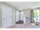 Light filled entryway with doors, gray flooring, and a play kitchen at 830 Black Rock Cir, Lebanon, IN 46052