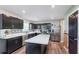 Modern kitchen featuring stainless steel appliances, black cabinets, and marble countertops at 830 Black Rock Cir, Lebanon, IN 46052