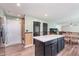 Open concept kitchen with island, offering seating, storage, and modern finishings at 830 Black Rock Cir, Lebanon, IN 46052
