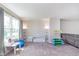 Spacious living room with carpet and an assortment of toys at 830 Black Rock Cir, Lebanon, IN 46052