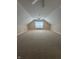 Finished attic space with neutral carpet and a ceiling fan at 8306 Hunters Meadow Way, Indianapolis, IN 46259