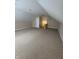 Finished attic area featuring an adjacent staircase at 8306 Hunters Meadow Way, Indianapolis, IN 46259