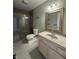 Bathroom featuring frameless glass shower, toilet, and single sink vanity at 8306 Hunters Meadow Way, Indianapolis, IN 46259