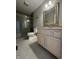 Bathroom featuring frameless glass shower, toilet, and single sink vanity at 8306 Hunters Meadow Way, Indianapolis, IN 46259
