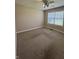 Empty bedroom with neutral color palette, carpet, window with blinds, and ceiling fan at 8306 Hunters Meadow Way, Indianapolis, IN 46259