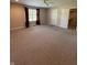 Bedroom with neutral color palette, carpet, window with curtains, and closet access at 8306 Hunters Meadow Way, Indianapolis, IN 46259