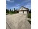 Traditional home featuring a brick facade and an attached two-car garage at 8306 Hunters Meadow Way, Indianapolis, IN 46259