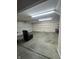Large garage featuring concrete floor, workbench, shelving, and plenty of room for storage at 8306 Hunters Meadow Way, Indianapolis, IN 46259