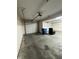 Spacious garage featuring two garage doors, bright lighting, and concrete flooring at 8306 Hunters Meadow Way, Indianapolis, IN 46259