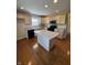 Eat-in kitchen boasts an island and modern appliances at 8306 Hunters Meadow Way, Indianapolis, IN 46259