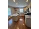 Modern kitchen with island and ample natural light from a large window at 8306 Hunters Meadow Way, Indianapolis, IN 46259