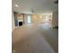Spacious living room with plush carpeting, a cozy fireplace, and ample natural light creates an inviting atmosphere at 8306 Hunters Meadow Way, Indianapolis, IN 46259