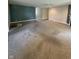 Expansive living room featuring a fireplace and neutral-toned carpet at 8306 Hunters Meadow Way, Indianapolis, IN 46259