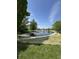 Scenic pond with a tranquil fountain, surrounded by lush greenery and decorative rock borders at 8306 Hunters Meadow Way, Indianapolis, IN 46259