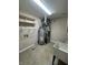 Bright utility room featuring modern water heater, HVAC, and ample shelving for organization at 8306 Hunters Meadow Way, Indianapolis, IN 46259