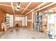 Unfinished basement featuring water heater, gas furnace, cabinets, and storage at 8980 Cinnebar Dr, Indianapolis, IN 46268