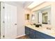 This bathroom features double sinks, cabinet storage, tile floors and bright lighting at 8980 Cinnebar Dr, Indianapolis, IN 46268
