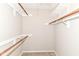 Walk-in closet features built-in shelving and ample storage space for your wardrobe needs at 8980 Cinnebar Dr, Indianapolis, IN 46268
