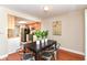 The dining area features a dark wood table with seating for six and is adjacent to the updated kitchen at 8980 Cinnebar Dr, Indianapolis, IN 46268