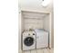 Convenient laundry room with washer and dryer hookups, shelving and tile floors at 8980 Cinnebar Dr, Indianapolis, IN 46268