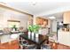Open-concept living room and dining area with lots of natural light and hardwood floors at 8980 Cinnebar Dr, Indianapolis, IN 46268