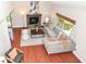 Spacious living room with a vaulted ceiling, fireplace, wood floors, and comfortable seating arrangement at 8980 Cinnebar Dr, Indianapolis, IN 46268