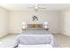 This primary bedroom features carpet floors, ceiling fan, and neutral paint at 8980 Cinnebar Dr, Indianapolis, IN 46268