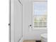 Bathroom with shower, toilet and window at 916 Ardsley Dr, Indianapolis, IN 46234