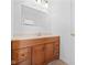 Bathroom vanity with storage and a large mirror at 916 Ardsley Dr, Indianapolis, IN 46234