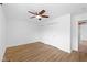 Bright bedroom with hardwood floors, ceiling fan, and double closets at 916 Ardsley Dr, Indianapolis, IN 46234