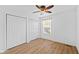 Bedroom featuring hardwood floors, a ceiling fan, and double closets at 916 Ardsley Dr, Indianapolis, IN 46234