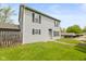 Two-story home with neutral siding, black shutters, and a well-maintained lawn, creating an inviting curb appeal at 916 Ardsley Dr, Indianapolis, IN 46234