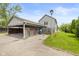Exterior view of a home with an attached carport and street lamp at 916 Ardsley Dr, Indianapolis, IN 46234