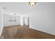 Bright living room featuring wood-look floors and a window for natural light at 916 Ardsley Dr, Indianapolis, IN 46234