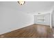 Bright, expansive living room with wood-look floors, neutral walls and ample natural light at 916 Ardsley Dr, Indianapolis, IN 46234