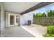 Outdoor patio with sliding glass door, air conditioner, and wooden fence at 916 Ardsley Dr, Indianapolis, IN 46234